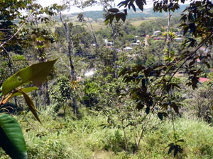 The town of Rio Piedras sits in a forested valley alongside the river at the head of the lake.